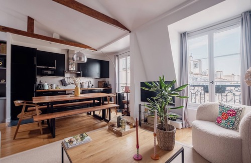 Clignancourt Apartment | Explore Beams and Dreams with Spa, Kitchen & Family Options