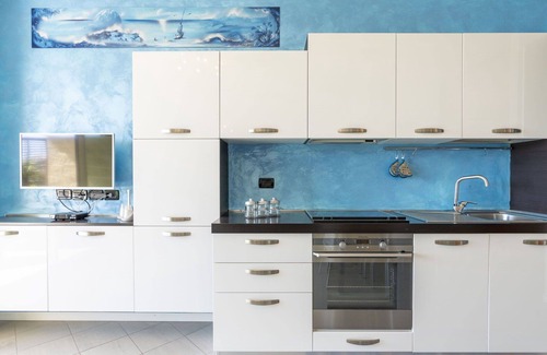Santo Stefano al Mare Apartment | Inviting Apartment for 4 with Pool, A/C, and Balcony