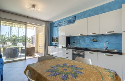 Santo Stefano al Mare Apartment | Inviting Apartment for 4 with Pool, A/C, and Balcony