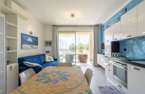 Santo Stefano al Mare Apartment | Inviting Apartment for 4 with Pool, A/C, and Balcony