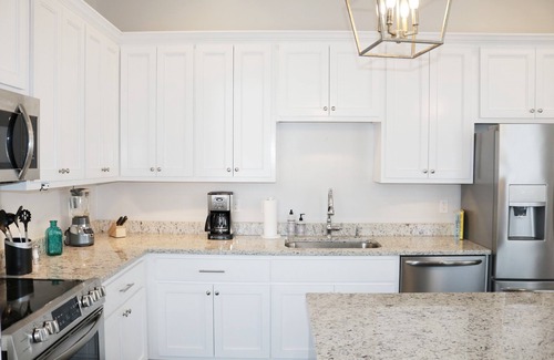 Lower Garden District Condo | Elegant 2-Bedroom Retreat with Balcony Near St. Charles