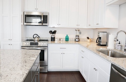 Lower Garden District Condo | Elegant 2-Bedroom Retreat with Balcony Near St. Charles