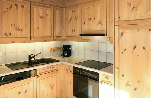 Laax Apartment | Scenic Apartment for 3 with Balcony & Lake View Amenities