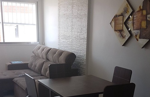 Praia Grande Apartment | Beautiful apartment in front of the sea, walk in the sand ....