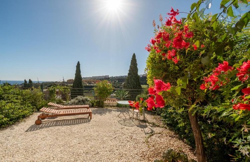 Castillo de Sabinillas Apartment | Serene Buganvillas Garden Property with Oceanfront Views