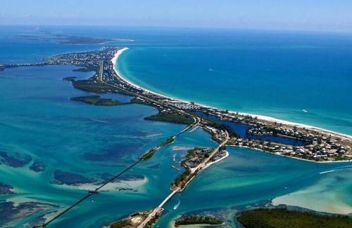 Pebble Beach House | Scenic Canal & Gulf Waterfront Home with Family-Friendly Perks