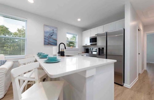Neptune Beach Apartment | Discover Summer by the Sea: Pet-Friendly Family Retreat