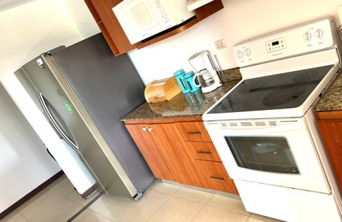 Barrio Santa Lucia House | Costa Rica Condo: Steps from the Beach with Pool Access