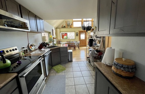 Elk Meadows Cabin | Scenic Log Cabin Retreat: Ocean Views & Spa Amenities