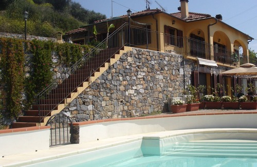 Regione Ronchi Apartment | Serene Retreat with Private Garden & Oceanfront Pool