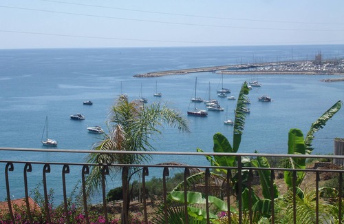 Regione Ronchi Apartment | Serene Retreat with Private Garden & Oceanfront Pool