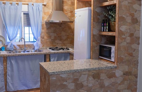 Almodovar del Rio Ski Chalet | Idyllic Retreat with Natural Caves and Private Saltwater Pool