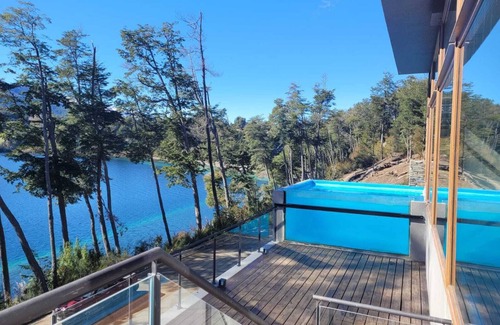 Correntoso Apartment | Tranquil Lakefront Retreat with Pool and Ocean Views
