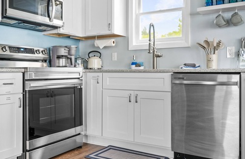 Cadillac House | Idyllic Lakefront Getaway with Breakfast & Family Amenities