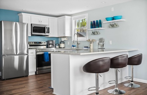 Cadillac House | Idyllic Lakefront Getaway with Breakfast & Family Amenities