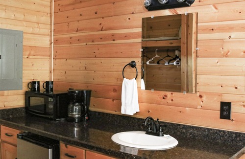 Pipe Creek Cabin | Charming Log Cabin with Pool and Kitchen Overlooking Meadow