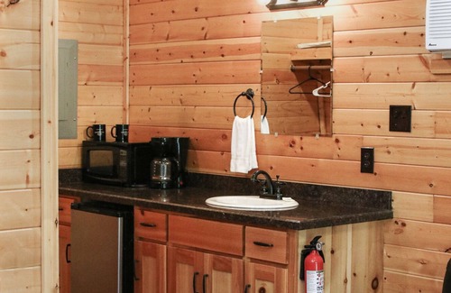 Pipe Creek Cabin | Charming Log Cabin with Pool and Kitchen Overlooking Meadow