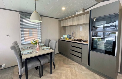 Lockerbie House | Picturesque Lakeside Lodge with Hot Tub and Scenic Views