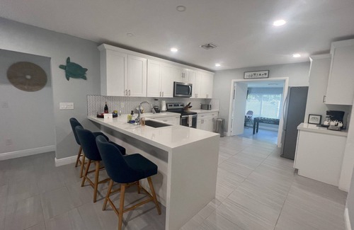 Highland Garden House | Welcoming Mango House: Oceanfront Retreat with Pool & Spa