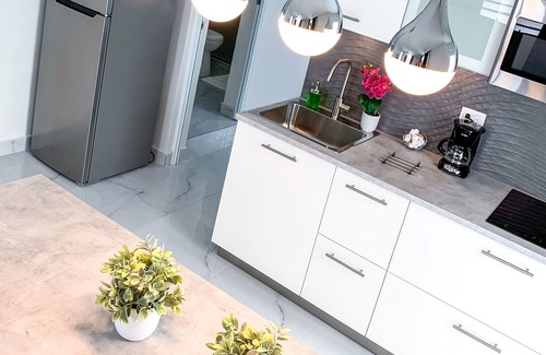 Isla Verde Apartment | Modern Apartment Steps from Airport and Beach - Rated 9.6