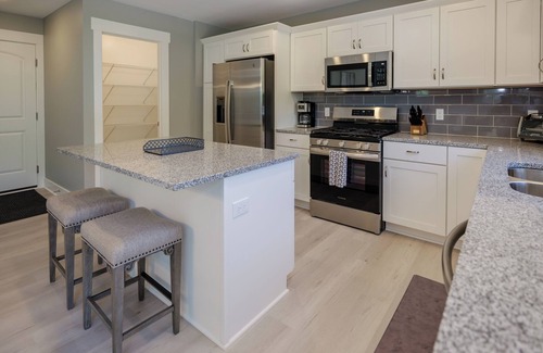 South Haven House | Beautiful new 6 bedroom with heated pool, fire pit and private setting