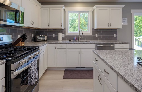 South Haven House | Beautiful new 6 bedroom with heated pool, fire pit and private setting