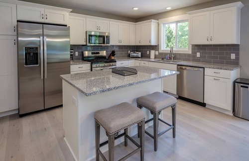 South Haven House | Beautiful new 6 bedroom with heated pool, fire pit and private setting