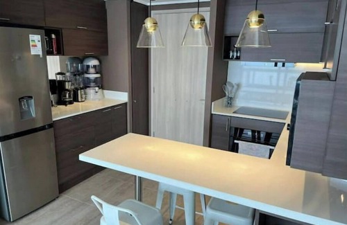 Concon Apartment | Serene Ocean View Apartment with Pool and Spa Amenities
