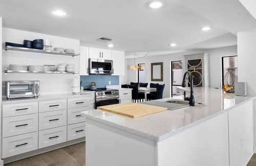 Baywood Village House | Beautiful Oceanfront 4BR Palm Harbor home w/pool, chef's kitchen, and boat dock