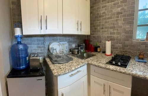 Coral Harbour House | Inviting One Bedroom Private Guest House with Pool Access