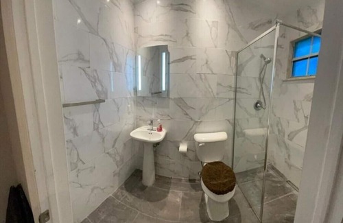 Coral Harbour House | Inviting One Bedroom Private Guest House with Pool Access