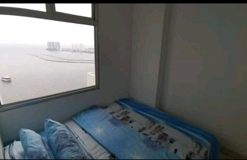 Pluit Apartment | Scenic Sea View 2BR with Fast WiFi and Pool Access