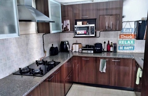 Noida Apartment | Cozy Serviced Apartment with Garden and Pool Views