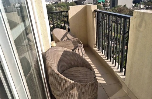 Noida Apartment | Cozy Serviced Apartment with Garden and Pool Views