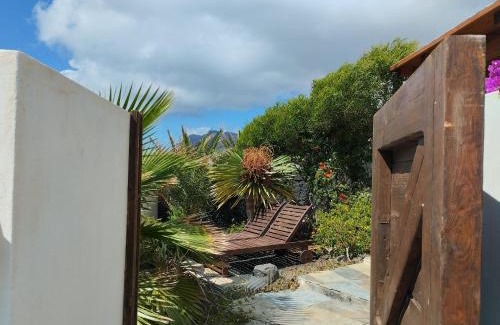 Urbanizacion Famara House | Picturesque Bungalow with Ocean Views and Lush Garden