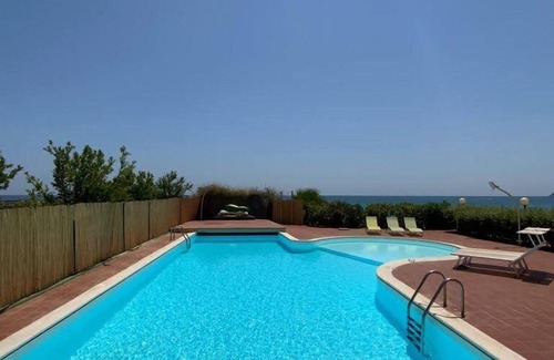 Sarroch Villa | Idyllic Split Villa with Beach Access, Pool & Tennis Court