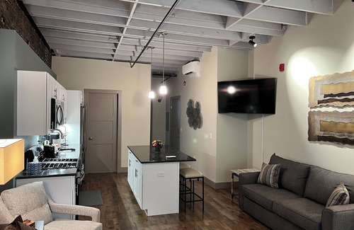 Downtown Syracuse Apartment | Beautiful Suite with Balcony overlooking Warren St in Syracuse