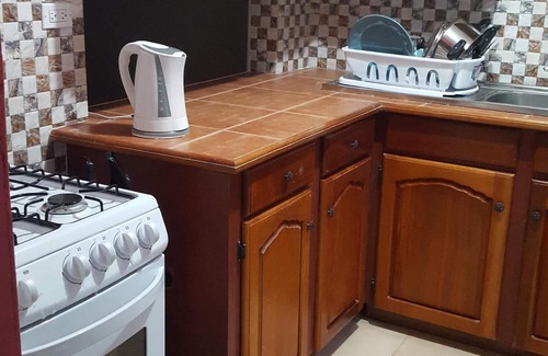 West Gate Hills Apartment | Enjoy Tallyman Condo with Pool & Breakfast in Montego Bay