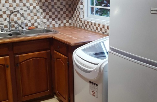 West Gate Hills Apartment | Enjoy Tallyman Condo with Pool & Breakfast in Montego Bay
