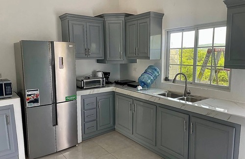 Spur Tree House | Scenic Apartment in St. Elizabeth with Pool & Mountain Views