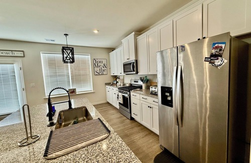Millville House | Beautiful townhome with community pool, shuttle to Bethany, and more!