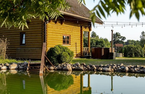 Milzkalne House | Exceptional Log Cabin Retreat with Pet-Friendly Amenities
