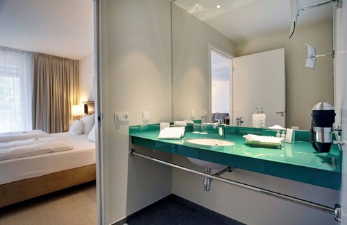 Ootmarsum Hotel | Beautifully Lit Room Overlooking Lush Parkland in Ootmarsum with Wellness Area