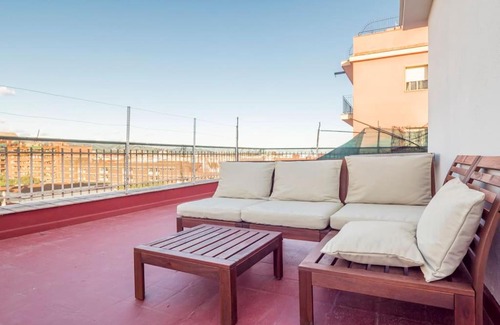 Porta Apartment | Inviting 3-Bedroom Attic in Sant Andreu with Terrace & WiFi