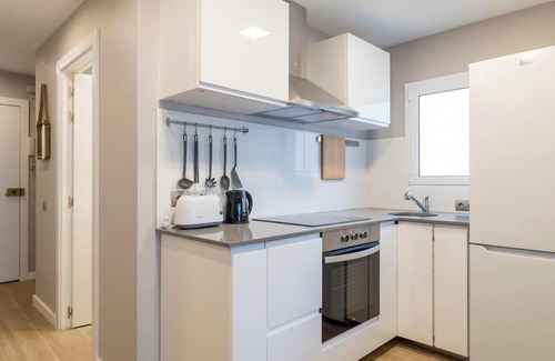 Porta Apartment | Inviting 3-Bedroom Attic in Sant Andreu with Terrace & WiFi