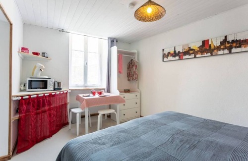 Cabrerets Apartment | Relaxing Bedroom with Dining Area & Garden View Amenities