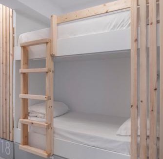 Fira Hostel | Beachfront Bedspot Hostel with Ocean Views & Full Kitchen