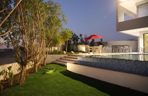 Al-Maghtas Villa | Beit Elhala Villa: Oceanfront Getaway with Pool & Hot Tub