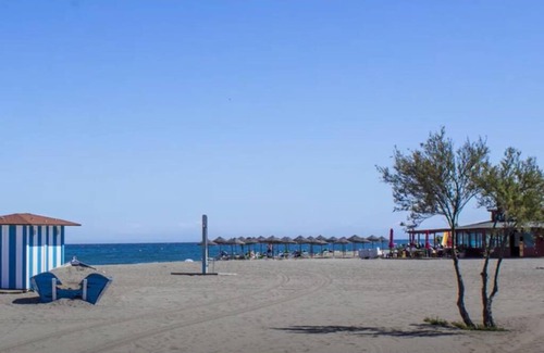 Puerto de la Duquesa Apartment | Elegant Apartment Steps from the Beach with Ocean View