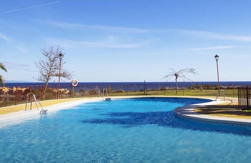 Puerto de la Duquesa Apartment | Elegant Apartment Steps from the Beach with Ocean View